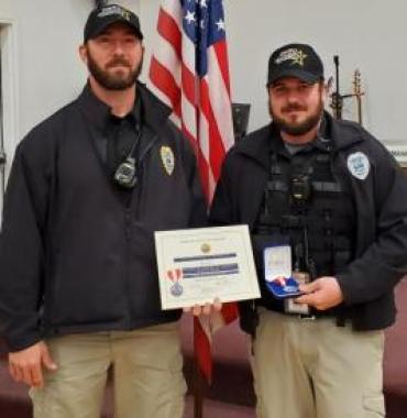 Officer Chad Core (right) with Lt. Jarod Cash