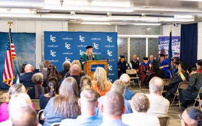 Graduation speaker at podium in front of an audience