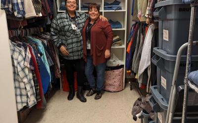 April and Christine stand for photo in "closet"